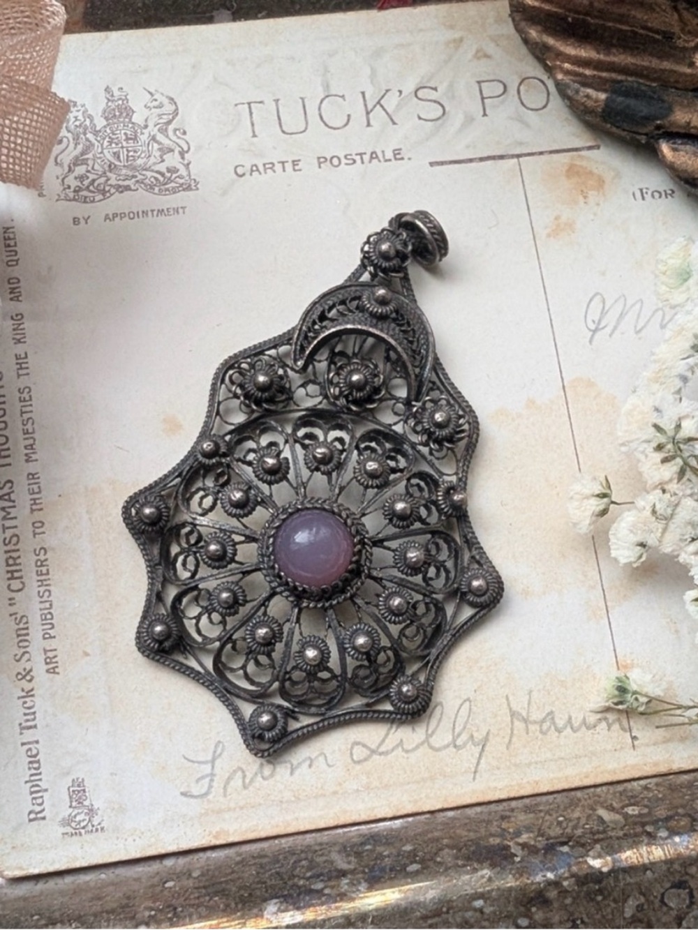 Ornate Silver Pendant with Purple Stone